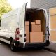 white delivery truck in line truck van to drop off shipments and packages between businesses