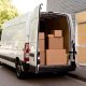 transit van courier delivery shipping vehicle preparing for cross-docking with truck for efficient shipping