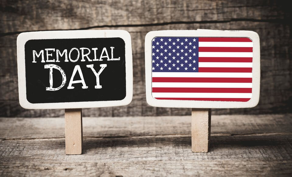 memorial day sign signaling that its time to start thinking about preparing for holiday for businesses and consumers shipping and avoiding delays or challenges