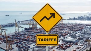 tariff sign about tariffs changing and increasing on a shipping yard showing how it affects interstate and commercial delivery services