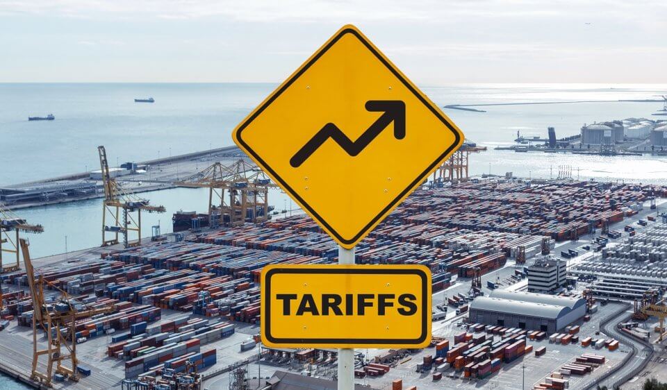 tariff sign about tariffs changing and increasing on a shipping yard showing how it affects interstate and commercial delivery services