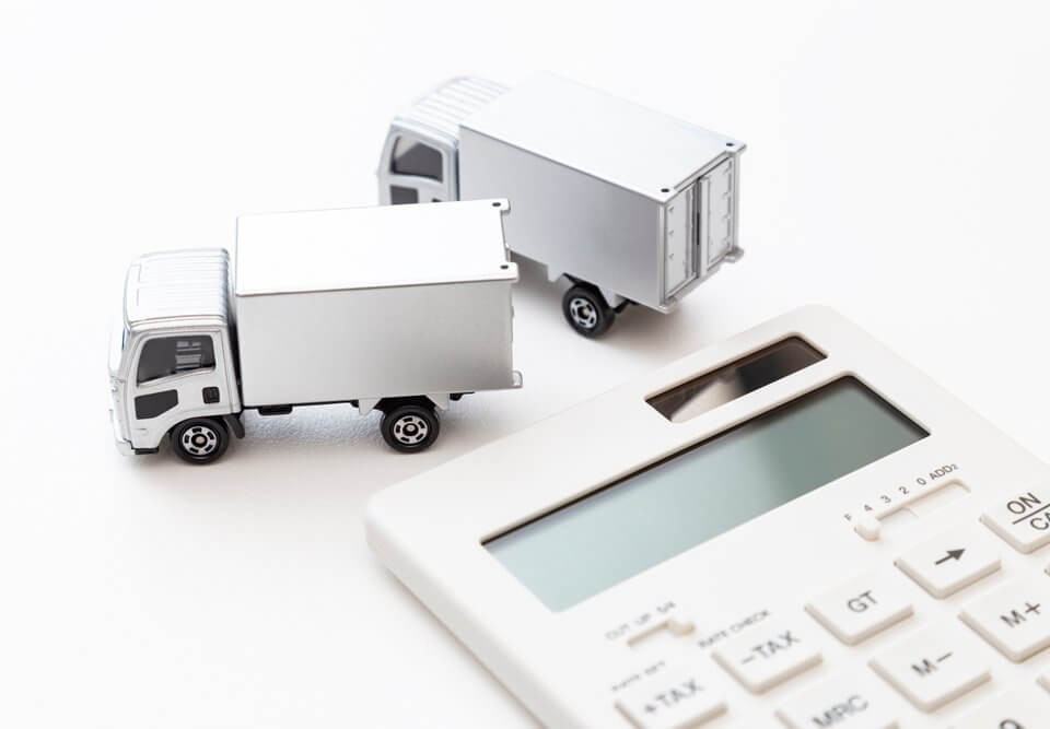 truck with a calculator trying to find the dimensional weight of a shipment for finding the shipping costs