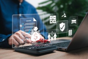 A person typing away at a laptop with several illustrations involving money, health, and other crucial aspects of buisness growth